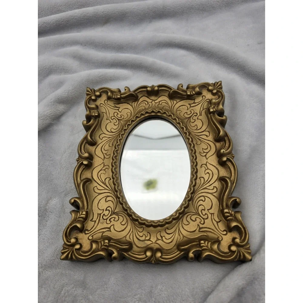 Vintage Oval Mirror In An Ornate Gold Victorian/Hollywood Regency Plastic Frame
